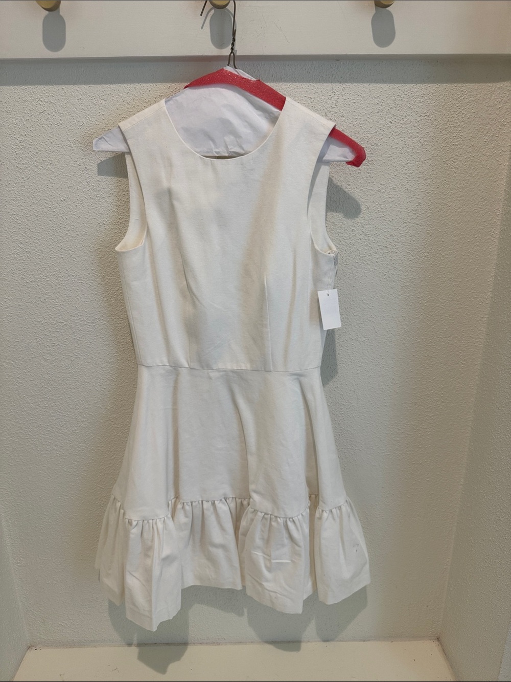 Sleeveless Cream Ruffle-Hem Mini Dress